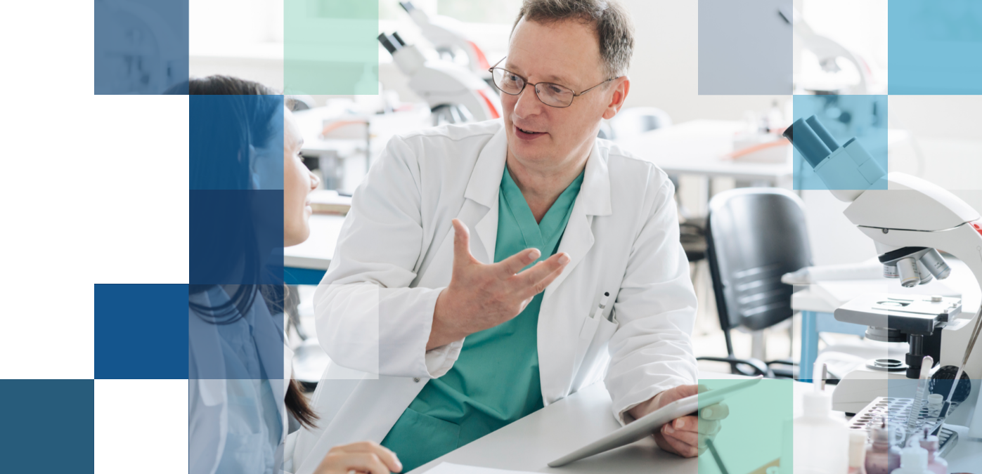 Two eye care professionals discussing the technology behind Bausch + Lomb contact lenses.